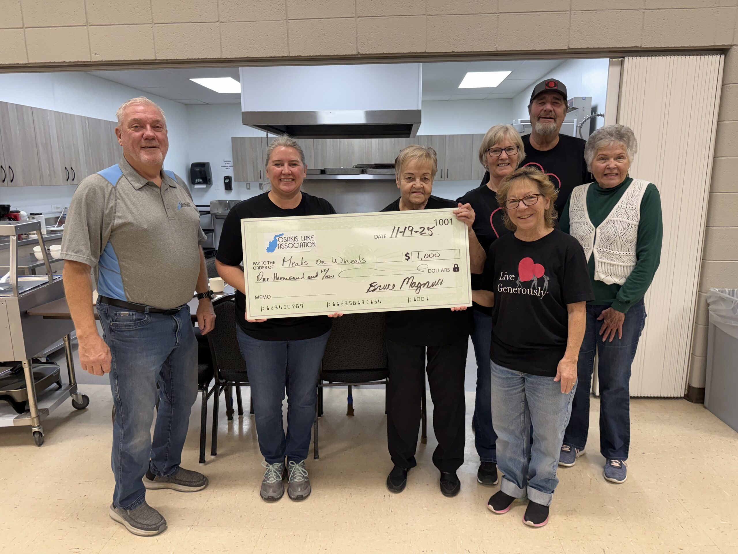 Through the Osakis Lake Association gambling proceeds, the Lake Association presented Meals on Wheels a donation to support Seniors in our community.  Pictured: Bruce Magnus OLA President, with Staci Helwig, Mary George, Sue Cole, Lori Stixrud, Mark Ferris and Laura Nichols.